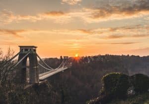 Clifton Suspension Bridge with sun setting behind it