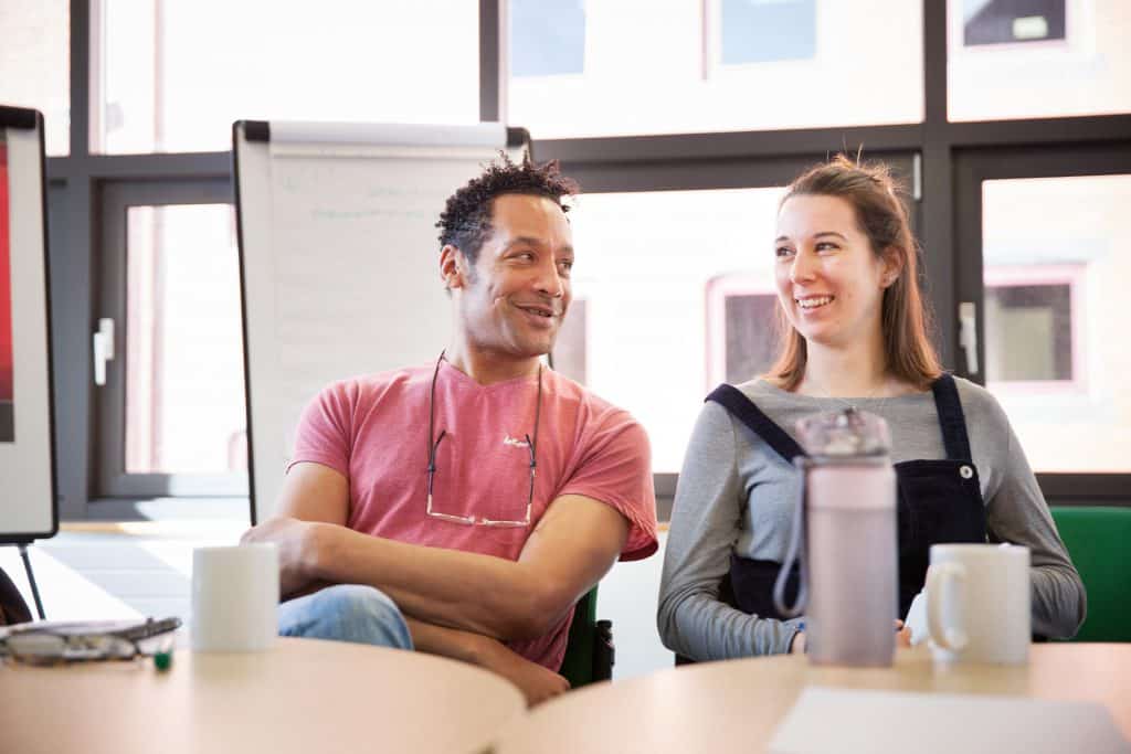 Two people smiling