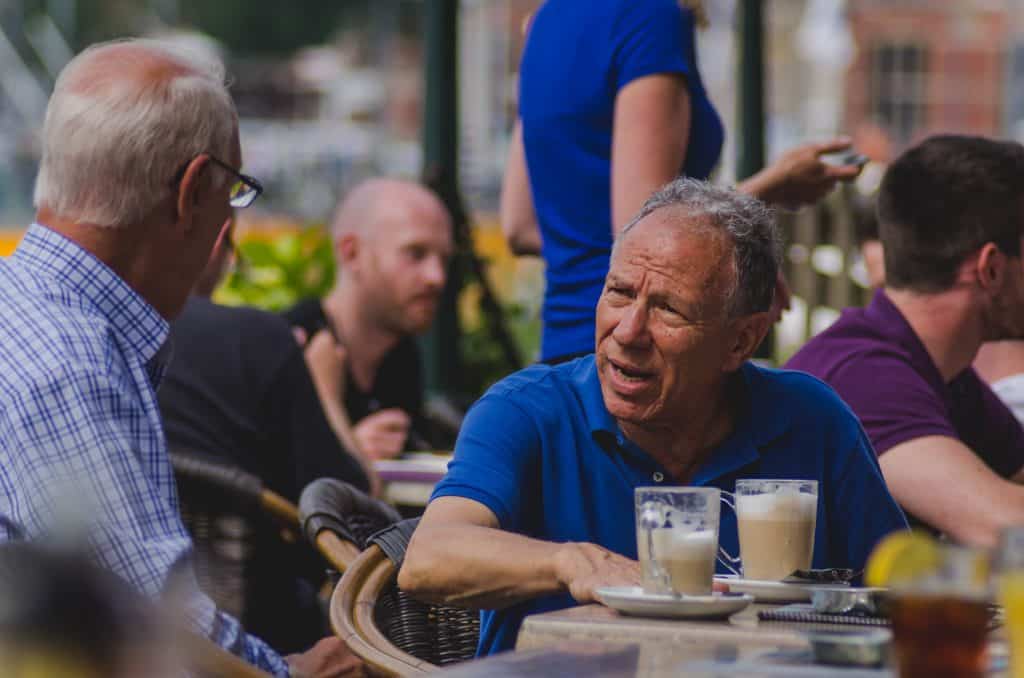 men talking over coffee