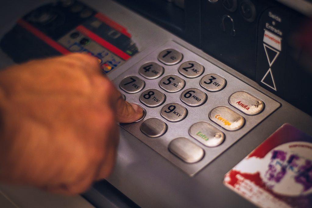 person using cash machine