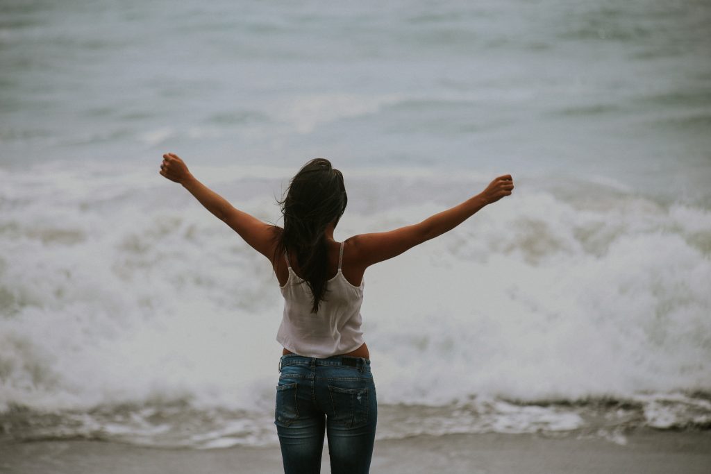 woman with arms in the air